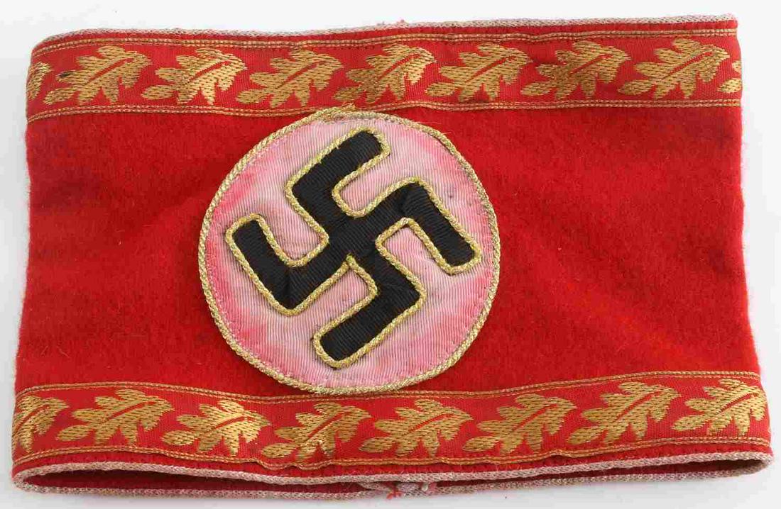 WWII GERMAN 3RD REICH NSDAP GAU HAUPTAMTES ARMBAND: WWII German Third Reich NSDAP GAU Kreis Leiter eines Hauptamtes Armband. Measures 7.75 inches long. The red felt has bled on to center near the swastika. Multi-piece embroidered construction. White pi