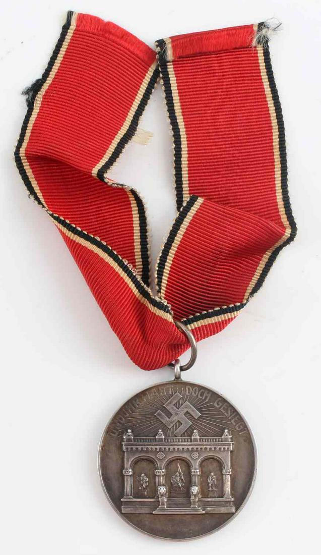 WWII GERMAN THIRD REICH NSDAP BLOOD ORDER MEDAL: WWII German Third Reich NSDAP Blood Order Medal. Marked "800" for genuine silver. The ribbon measures 8 inches long and has some fraying on each side.