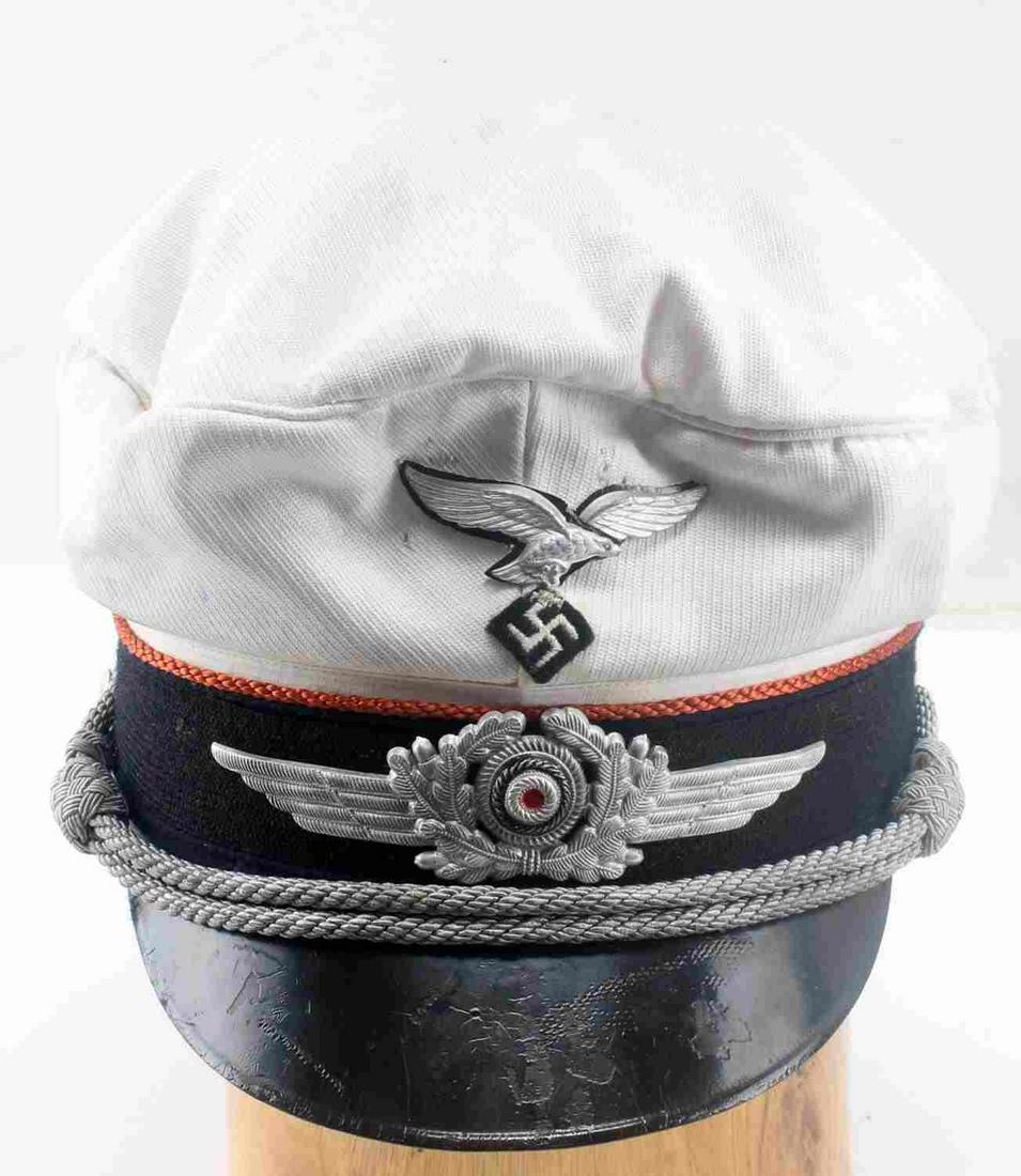 WWII GERMAN THIRD REICH LUFTWAFFE SUMMER VISOR: WWII German Third Reich Re-Enactors Luftwaffe Summer Visor. Original swastika was removed but, it has been replaced. Inside lining has been ripped out. "D.K." has been inscribed on the inside band. Go