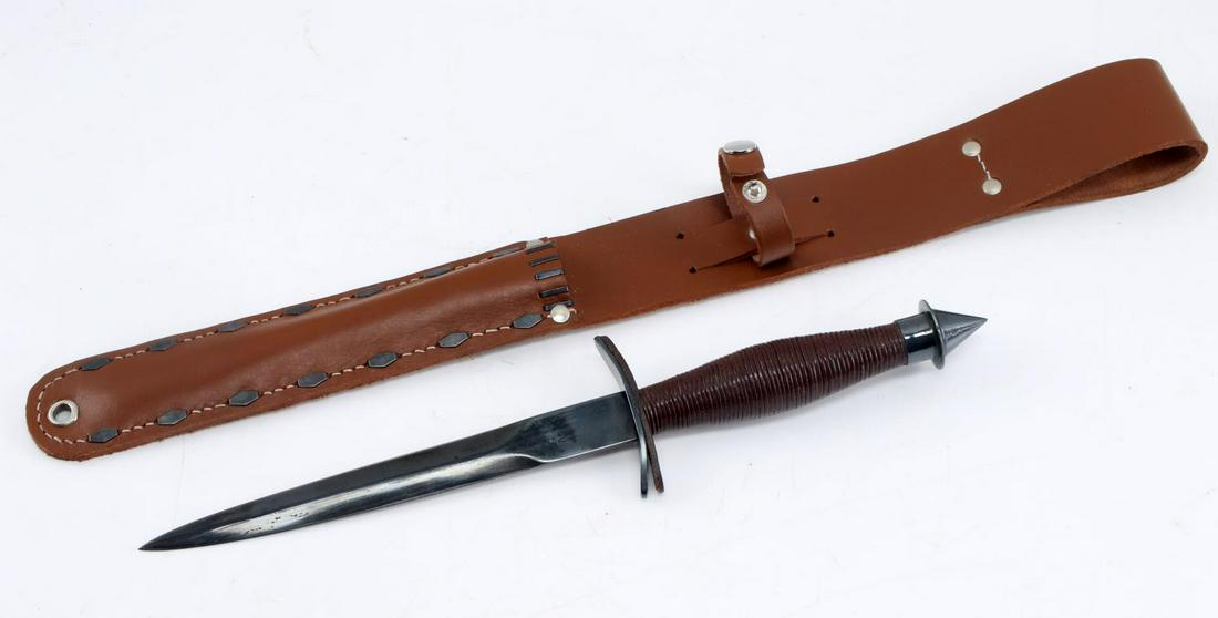V 42 STILETTO FIGHTING KNIFE WITH SCABBARD: V-42 Stiletto Fighting Knife with Scabbard. Knife is not marked. Some discoloration on th blade, complete with leather sheath. Blade measures 7.25 inches, entire dagger measures 13 inches. Skull crush