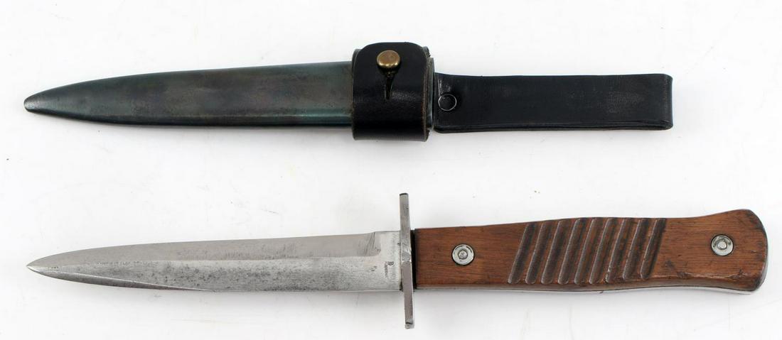 WWII GERMAN THIRD REICH BOOT KNIFE WITH SCABBARD: WWII German Third Reich Boot Knife with Scabbard. Makers mark of "Gottlieb Hammesfahr Solingen Foche". Reverse marked "Germany". Some pitting on the blade. Wooden handle. Blade measures 5.5 inches and