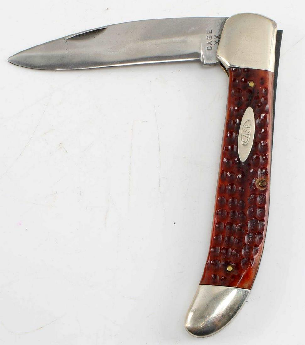 VINTAGE 1960S FOLDING CASE HUNTING KNIFE: Vintage 1960s Folding Case Hunting Knife. The knife measures approximately 9 inches when extended. The blade is marked "Case XX" and reverse marked "6165SAB". The handle is composed of a laminated woo