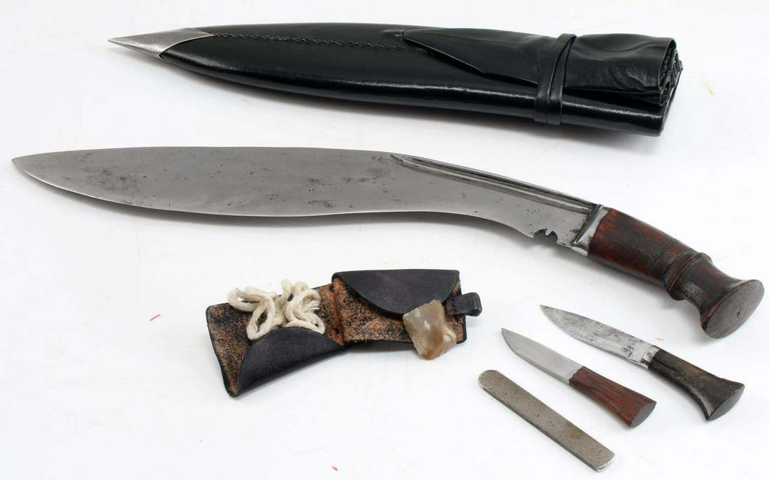 ETCHED GURKHA KUKRI BOWIE KNIFE WITH SHEATH: Etched Gurkha Kukri Bowie Knife with Sheath. The spine is etched with Nepalese characters. There is some pitting on the blade. Handle is composed of a red wood. The blade measures 15 inches, the entir