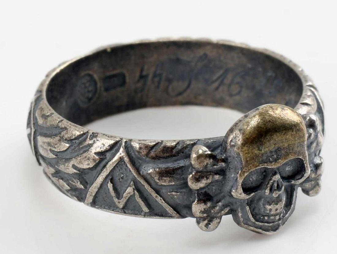 WWII REICH GERMAN SS HONOR RING HIMMLER SIGNATURE: WWII SS Honor ring, with name of recipient date of award, and Heinrich Himmler's signature on inside band Size 10. Maker's mark on inside of band. Unauthenticated, sold as is. This lot has a reserve.