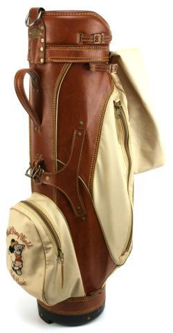 BURTON GOLF BAG WALT DISNEY WORLD CLASSIC: Leather and canvas golf bag in brown and tan. Embroidered Mickey Mouse and "Walt Disney World, Golf Classic". By Burton Mfg Co. Jasper, Alabama. Very good condition.