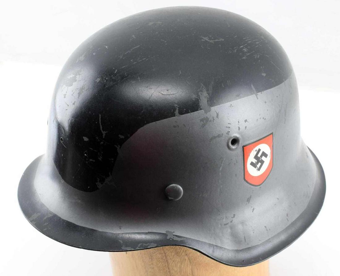 WWII GERMAN THIRD REICH M42 DOUBLE DECAL HELMET: German WWII M-42 Double Swastika Decal. Camouflage Combat Helmet. The exterior helmet shell is painted in a light grey and black camo paint. Each side has a swastika shield decal on each side. The ins