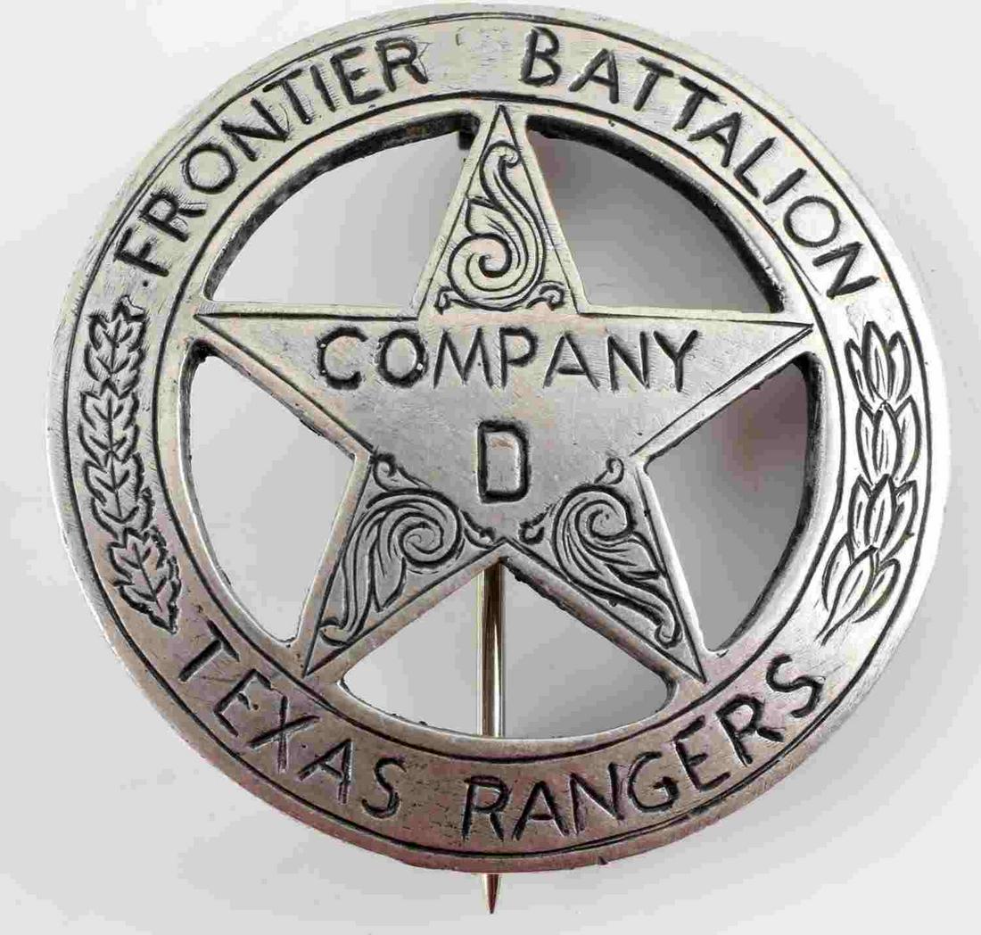 TEXAS RANGERS FRONTIER D COMPANY LAW BADGE: Texas Rangers Frontier D Company Law Badge Obsolete. Measures 1 9/16” in diameter. The front reads ‘FRONTEIER BATTALION COMPANY D TEXAS RANGERS’. There is an engraved oak leaf design on each sid