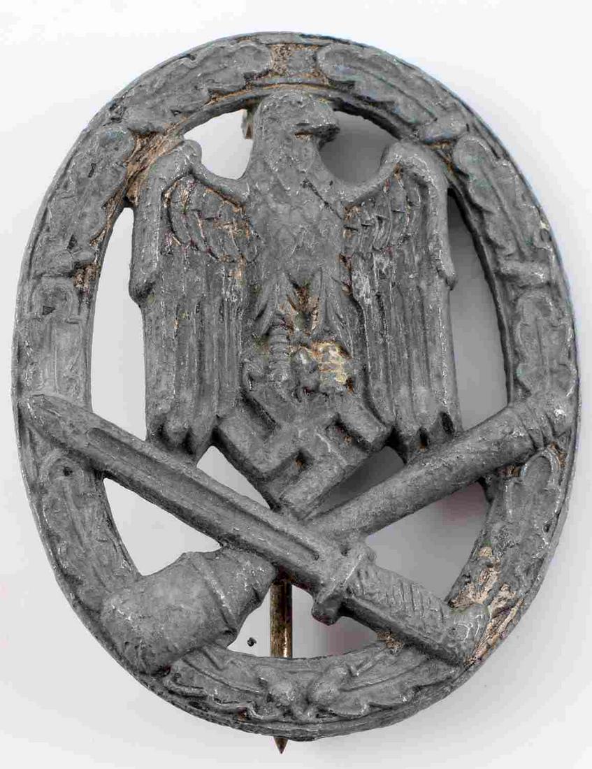 WWII GERMAN THIRD REICH HEER GENERAL ASSAULT BADGE: German WWII Army Silver General Assault Badge. The front shows a German army eagle clutching a swastika in his talons. There is a crossed bayonet and potato masher stick grenade at the base. All three