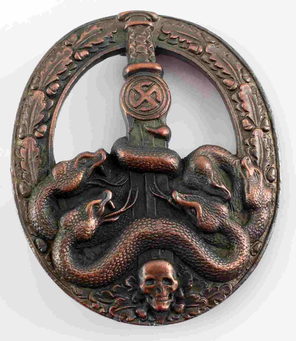 WWII GERMAN ARMY HEER BRONZE ANTI PARTISAN BADGE: German WWII Army Heer Bronze Anti Partisan Badge. Measures 2 3/8" tall by 2" wide. The front shows five snakes on the lower part of the badge wrapped around a sword blade with a skull at the base. All