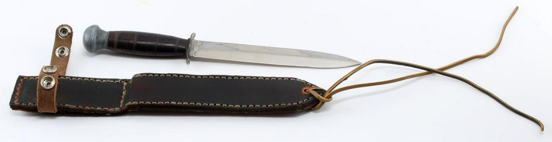 WWII U.S. DOUBLE EDGED CHROMED FIGHTING KNIFE: Very good original example, knife measures overall 11 1/2 inches, with hand crafted leather scabbard.