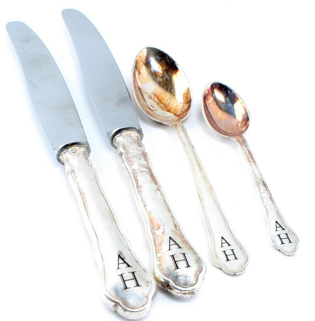 WWII GERMAN 3RD REICH ADOLF HITLER SILVERWARE LOT: WWII German Third Reich Adolf Hitler Silverware Lot. includes two butter knives and two spoons. The spoons have oxidation on the face. The knives are stamped "Rostfrei 800", spoons are stamped "800". 