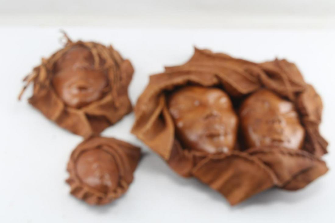LEATHER MASK SCULPTURE FEMALE PORTRAIT WALL ART: Leather sculpted and tooled wall art collection. Hand made, rich caramel color, detailed female portraits. Dimensions: 17x14 inches, 11x8 inches, 7x5 inches.