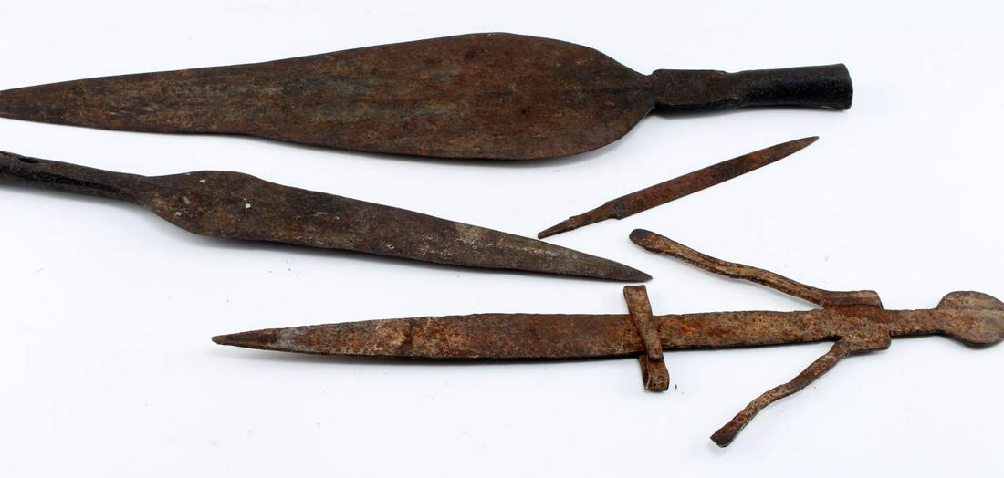 AFRICAN SPEAR HEAD AND ETHNOGRAPHIC KNIFE LOT: Three iron spear heads 21 inches, 16 inches and 8 inches in length along with a knife with a humanoid figure handle, total length 17 1/4 inches. This lot has a reserve.