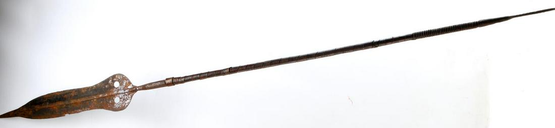 ANTIQUE AFRICAN CONGO TRIBAL KUBA METAL SPEAR: African Congo Tribal Kuba Metal Spear. The spear measures 59.5 inches in total. The spearhead measures 17 inches long. The spear has a strong patina. Good condition. This lot has a reserve.
