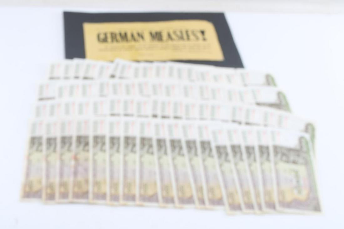 CAMBODIAN BANK NOTES 1970S & GERMAN MEASLES SIGN: Lot of international timepieces: 73 Cambodian banknotes from 1972-1975, each with a denomination of 100 Riels and one paper sign published by the Commonwealth of Pennsylvania, Department of Health, me