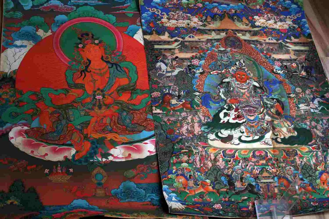 LOT OF TWO TIBETAN BUDDHIST TANKA BACKED W PAPER: Tara tanka measures 22.75 inches by 35.5 inches. Tanka of dorje drolo measures 25 inches by 35.5 inches. Both in good condition with some small areas of staining.