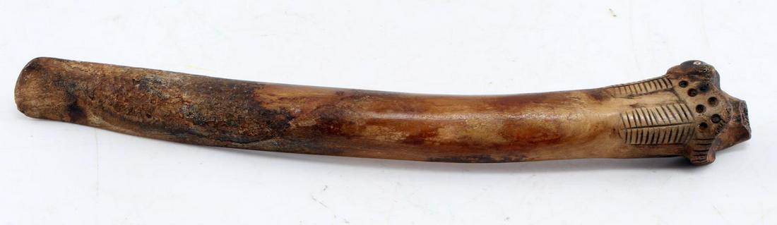 16TH CENTURY INCA CARVED DECORATED BONE TOOL: Possibly a weaving tool. Carved animal at top. Measures 10 inches. In good condition.