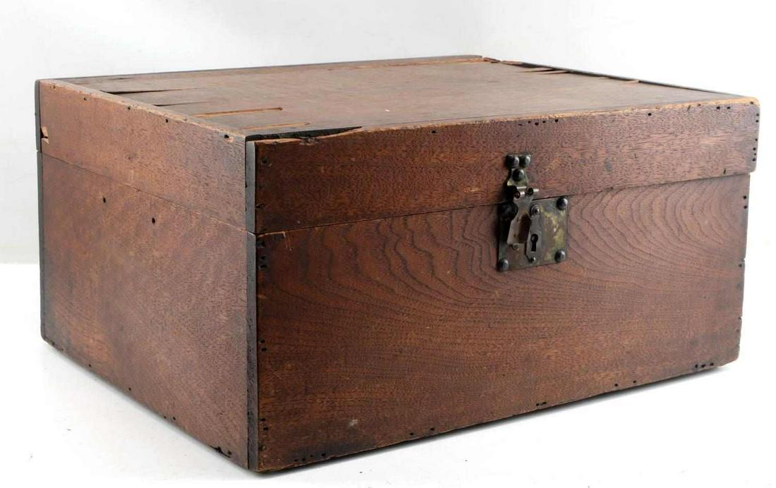 CIVIL WAR ERA WOOD STORAGE BOX: Civil War Era box, 19x15x9 inches with leather hinges and later metal backup hinges, square head penny nails, and old lock without its key. There is some loss and splitting to lid and base plate will