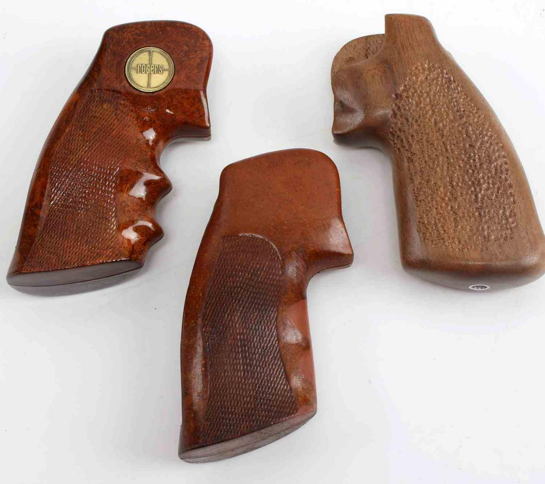 COLT PYTHON 357 OFFICER MODEL GRIP LOT OF THREE: Colt Python 357 Officer Model Grip Lot of Three. One grip has a gold tone "Rogers" hallmark, the other two are unmarked. One composed of wood, the other two are redwood composite. The entire lot is in
