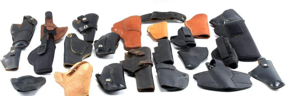 LOT OF 24 PISTOL REVOLVER HOLSTERS LEATHER NYLON: All sizes, different material, mostly leather. Some brands include: Hellweg, Hunter, and Viking Mexico. Good to very good condition.