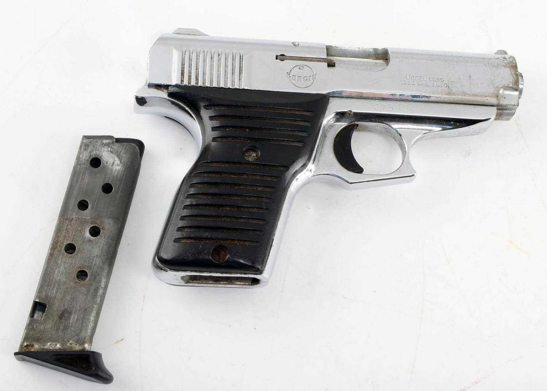 CHROME LORCIN L380 SEMI AUTO PISTOL .380 CAL: Chrome finish with maker mark to left side, maker, model, and caliber marked to right side, serial number below on frame, black hard plastic grooved grips. Barrel measures 3.5 inches long with fair bo