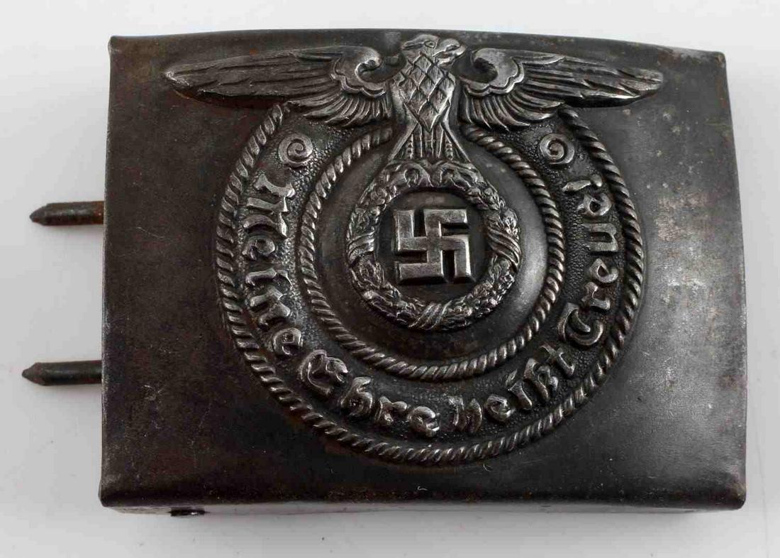 WWII THIRD REICH GERMAN SS EM BELT BUCKLE: WWII German SS EM two piece construction belt buckle measuring 3.5 inches by 2.5 inches and reading "Meine Ehre heisst Treue", Maker's mark RZM 3642 stamped on the reverse side. Buckle shows some fadi