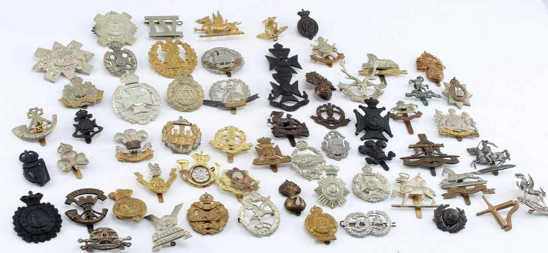 WWII BRITISH ARMY CAP INSIGNIA BADGE LOT OF 60: Large WWII British Visor Cap Badge Lot of 60. Made from aluminum, nickel steel, and brass. There is a 17th Lancer Division badge included in the lot. Condition ranges from very good to fine. Unauthent