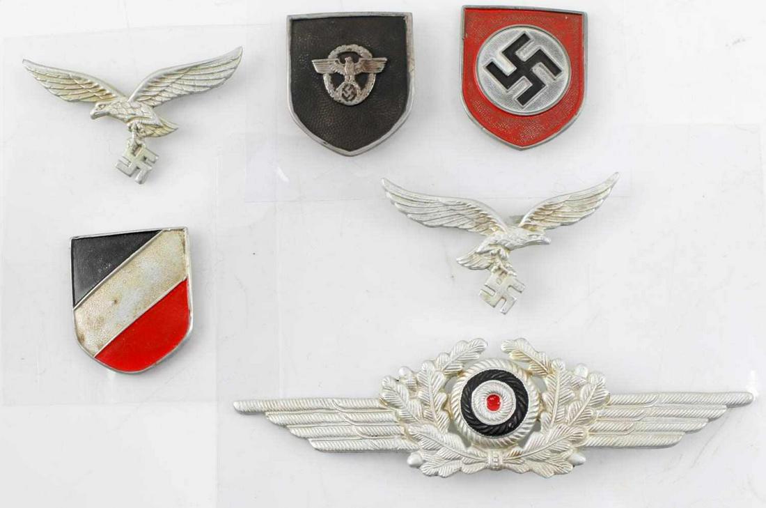 WWII GERMAN 3RD REICH LUFTWAFFE HELMET SHIELD LOT: WWII German Third Reich Luftwaffe Helmet Shield Lot of 6. Lot includes shields for the Luftwaffe Pith Helmet, Police Helmet and Luftwaffe Officer Visor Cap. All are on plastic backing. Very good condi