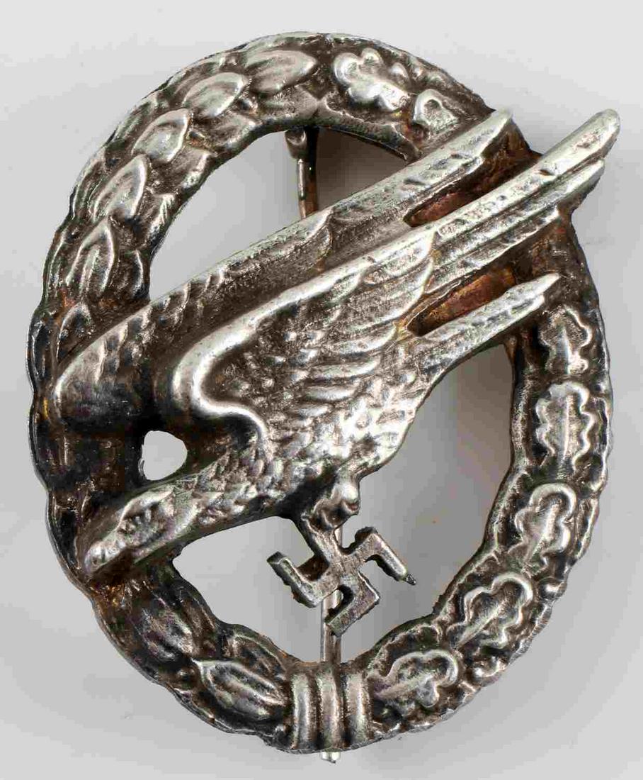 WWII GERMAN 3RD REICH LUFTWAFFE PARATROOPER BADGE: WWII German Third Reich Luftwaffe Paratrooper Badge. Vertical pin back. Some pitting and discoloration on the rear. Unmarked type. Very good condition. Unauthenticated; sold as is.