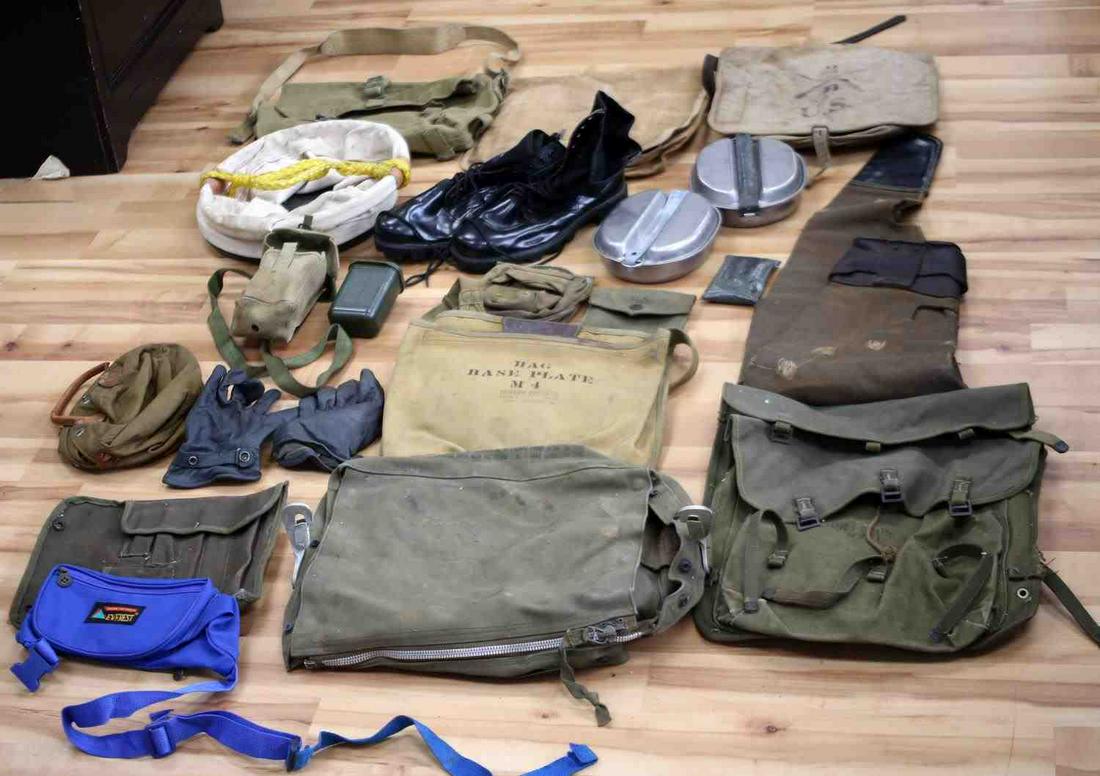 US MILITARY MIXED CONFLICT BAG BOOTS MESS KIT LOT: US Military Mixed Conflict Bag Boots and Mess Kit Lot. The Mess Kits are stamped "1941" and "1945". The bags included are a M4 Base Plate, two M2A1 Ammunition bags, Pneumatic Raft Type C-2A bag, US Mi