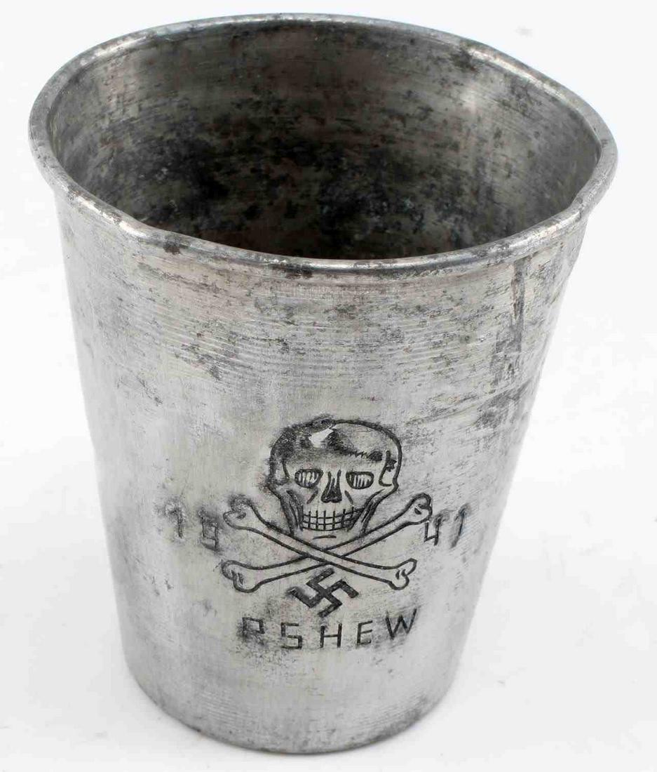 WWII GERMAN 3RD REICH WAFFEN SS RZHEV BATTLE CUP: WWII German Third Reich Waffen SS 1942 Battle of Rzhev Cup. Some pitting and discoloration the cup. Measures 3 inches tall, mouth measures 2.65 inches wide. Good condition. Unauthenticated; sold as is