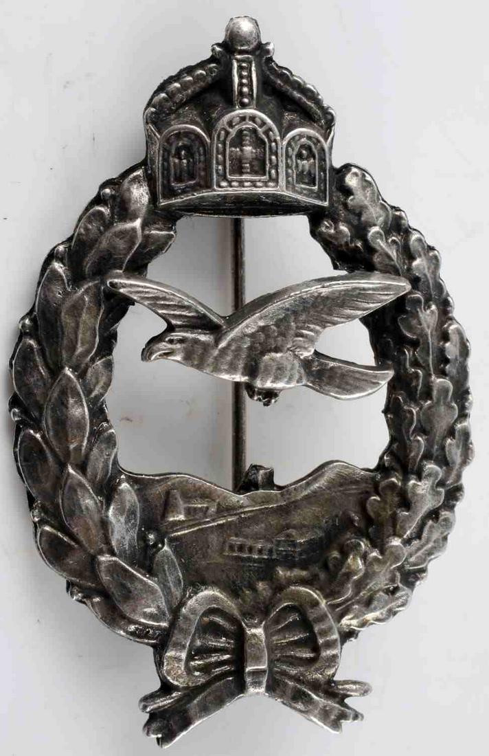 WWI IMPERIAL GERMAN PRUSSIAN HEER PILOT BADGE: WWI Imperial German Prussian Heer Pilot Badge. Thin Vertical pin back. There is pitting and discoloration throughout the badge. Measures 2.75 inches in length. Overall, very good condition. Unauthenti