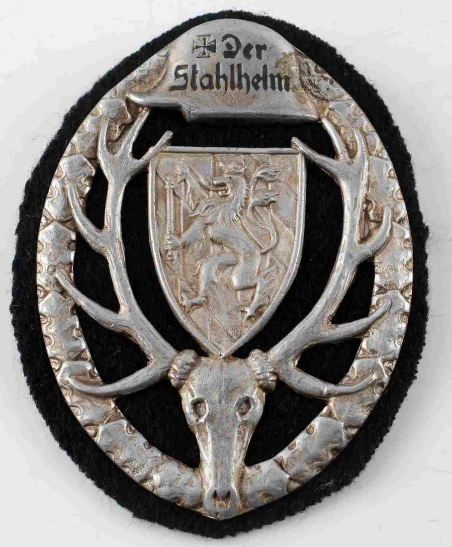 WWII GERMAN THIRD REICH STALHELM HUNTING BADGE: German 3rd Reich period Stalhelm Hunting Society badge. Measures 3 inches by 2 inches. Inscribed with "Der Stahlhem" on front helmet. Makers markings on back reading "LN". Broad style pinback. light p