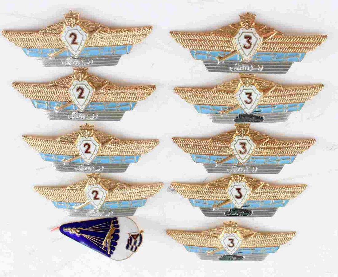 LOT OF 10 CUBAN OFFICERS MILITARY WINGS: Most feature tanks on the wings. One paratrooper/airborne badge. Most have broad style pinbacks. Overall, very good condition. Guaranteed original by consignor.