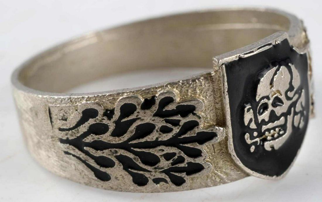 WWII GERMAN WAFFEN SS TOTENKOPF SILVER RING 12.5: Silver ring with black enamel, Totenkopf to front center and oak leaf design at each side. Totenkopf in enamel to back. Size 12.5, Himmler's signature to interior, 800 marked to exterior. Very good co