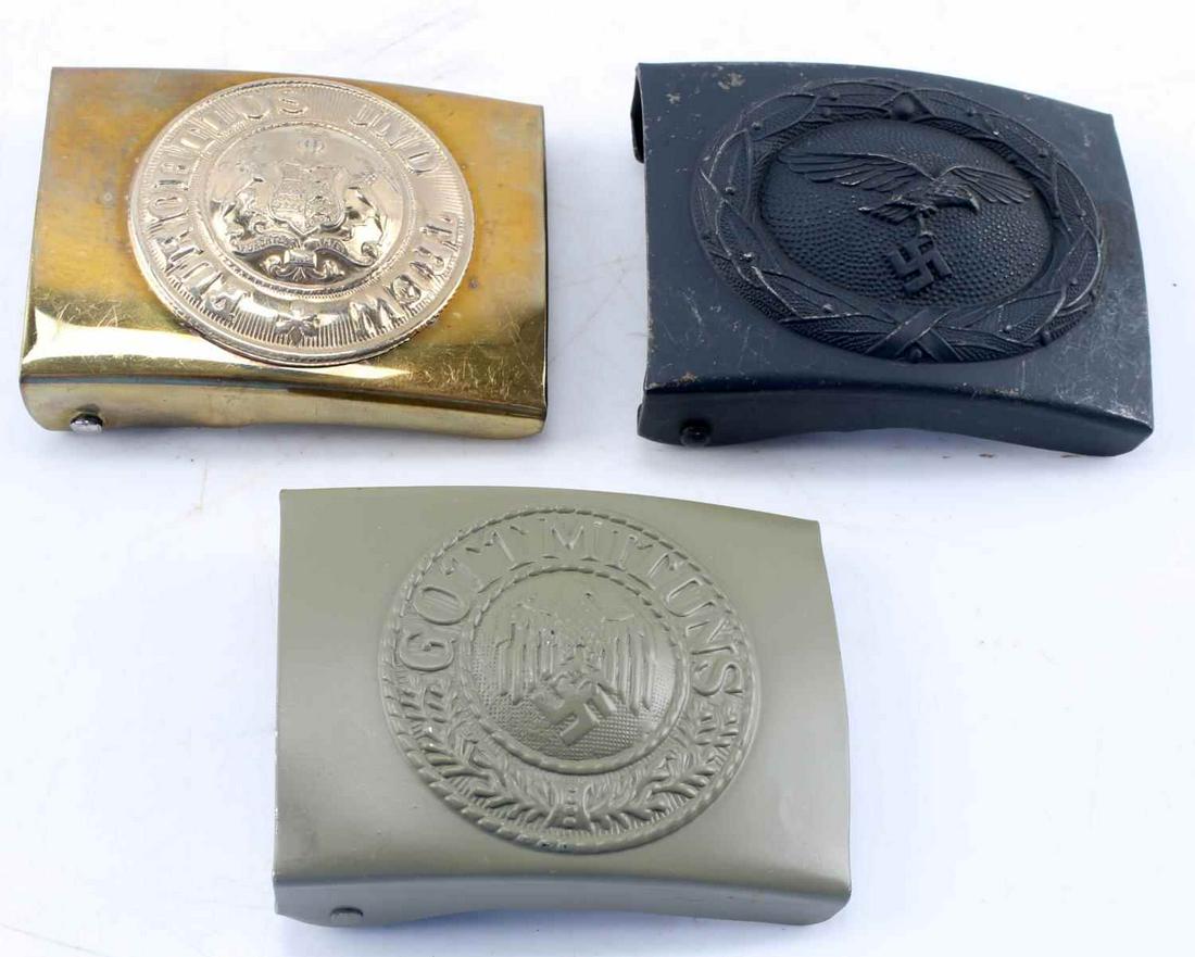 WWII GERMAN 3RD REICH LUFTWAFFE BELT BUCKLE LOT 3: WWII German Third Reich Luftwaffe Belt Buckle Lot of 3. Lot includes one Luftwaffe buckle marked "A" for Assmann. Lot also includes two Heer buckles, both unmarked and showing signs of a patina/finish