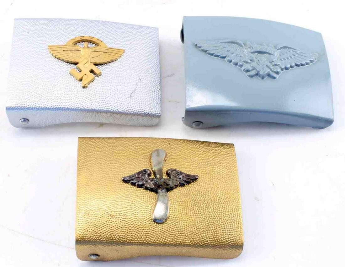 WWII GERMAN 3RD REICH LUFTSCHUTZ BELT BUCKLE LOT 3: WWII German Third Reich Luftschutz Belt Buckle Lot of 3. Lot includes one Luftschutz, one NSKK and one Flieger Korps buckle. All are unmarked. Post war type. Very good conditon. Unauthenticated; sold 