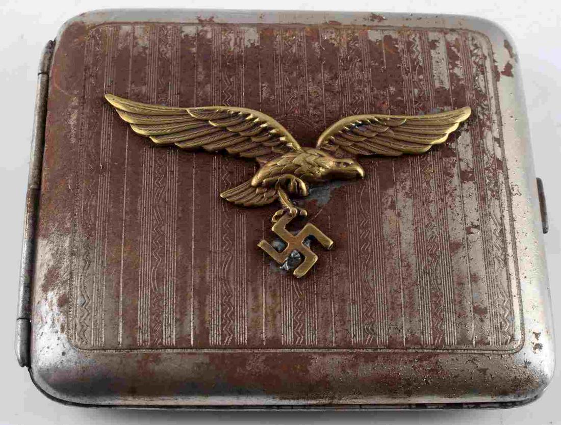 WWII GERMAN THIRD REICH LUFTWAFFE CIGARETTE CASE: German WWII Third Reich period Panzer Iron Cross Winner's cigarette case. Case measures 3.5 inches by 3 inches closed. Front of case features Luftwaffe insignia. Back of case has ornate pattern. Insid