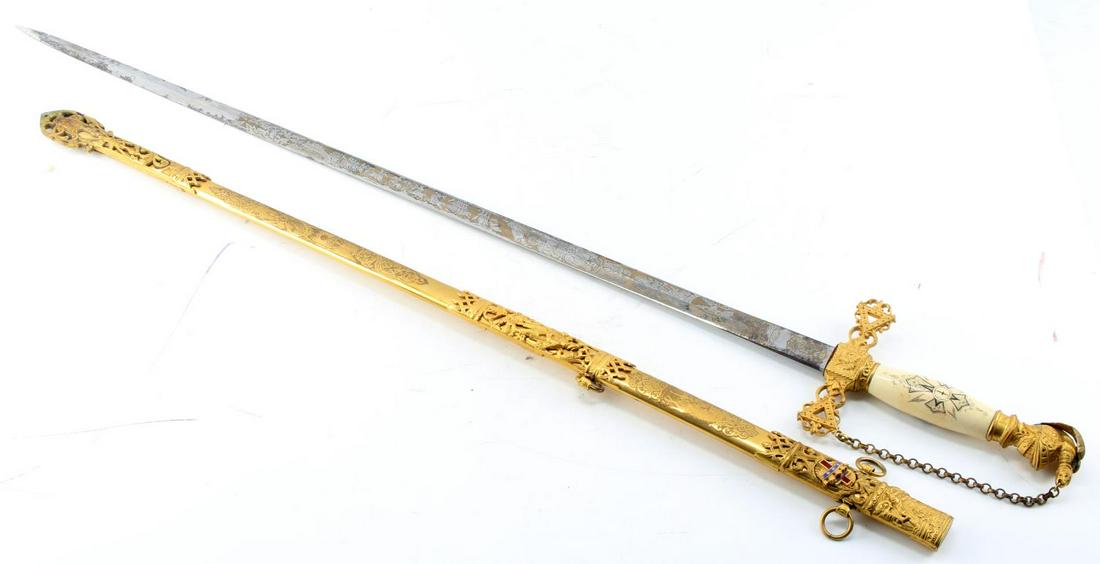 ANTIQUE KNIGHTS OF COLUMBUS FRATERNAL SWORD: Very fine etched and named blade, does have light surface rust, eagle head pommel, tusk grip, near excellent gilt on scabbard. Over 100 tears old, we will not ship international, and please understand