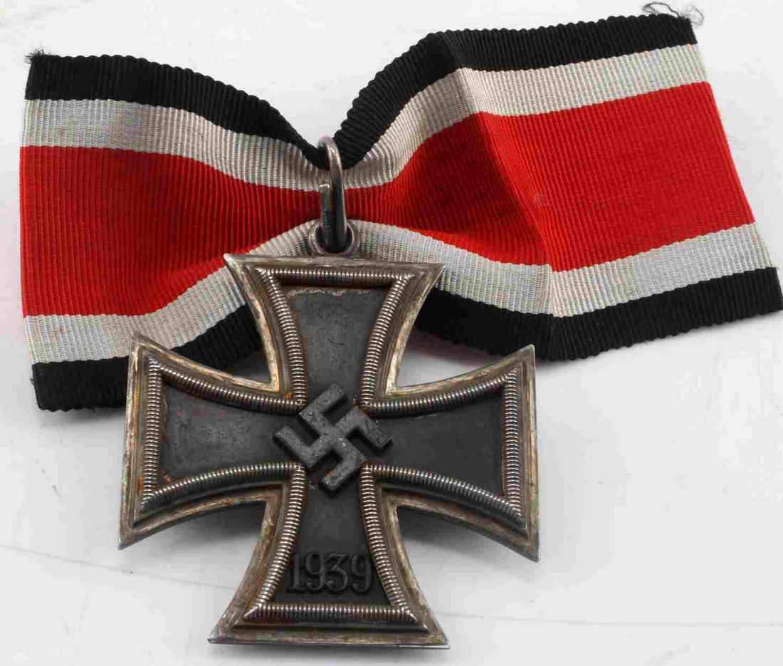 WWII GERMAN KNIGHTS CROSS JUNCKER TYPE 800 SILVER: 1939 Knight's Cross with ribbon. Marked 800 at top of reverse of cross and on prong. Real silver with magnetic center. Small ribbon with dimples on the side. Very good condition. This lot has a reserv