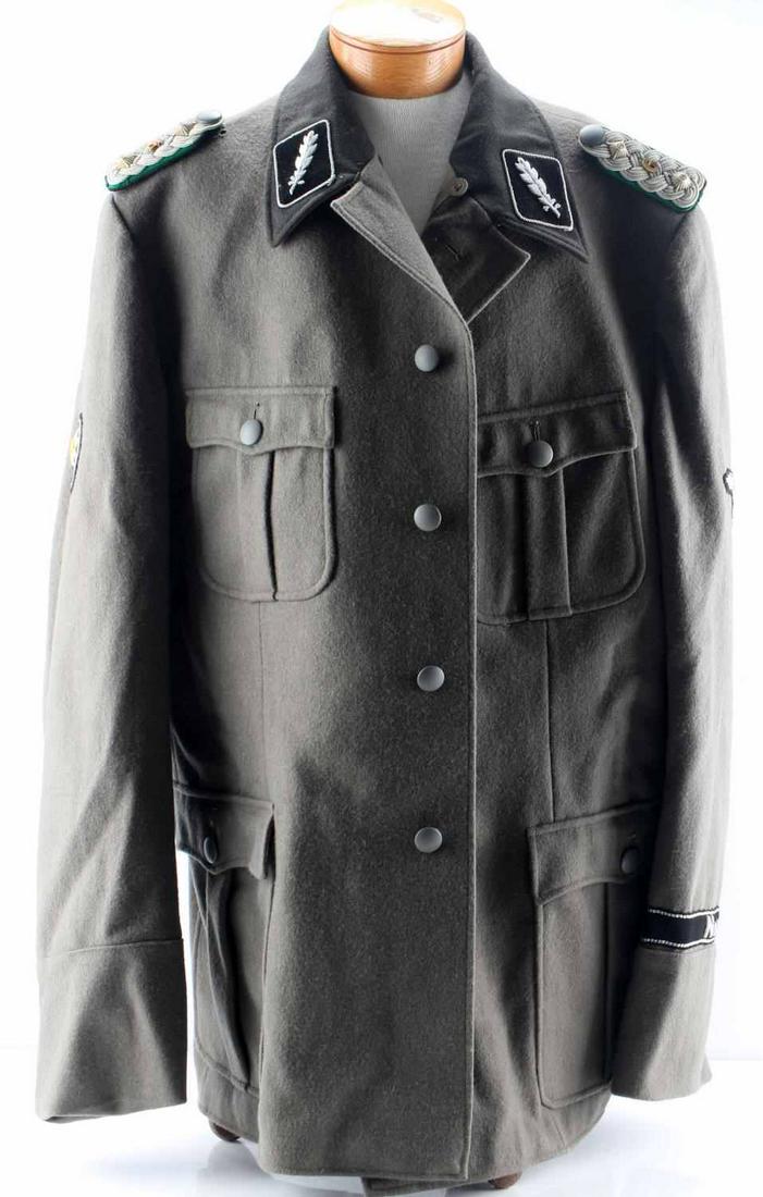 WWII GERMAN THIRD REICH SS STANDARTENFUHRER JACKET: WWII German Third Reich SS Standantenfuhrer's jacket. Jacket features officer's shoulder boards and lapel patches. On the right sleeve is an edelweiss patch. On the left sleeve is a Reichsadler patch 