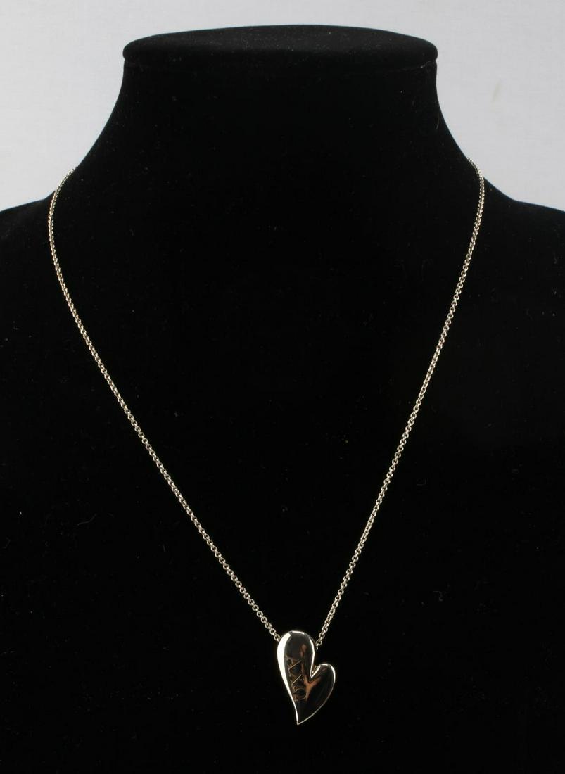 TIFFANY AND CO SORORITY HEART PENDANT NECKLACE: Sterling silver 20 inch Tiffany & Co. necklace with Alpha Chi Omega symbol on heart pendant.