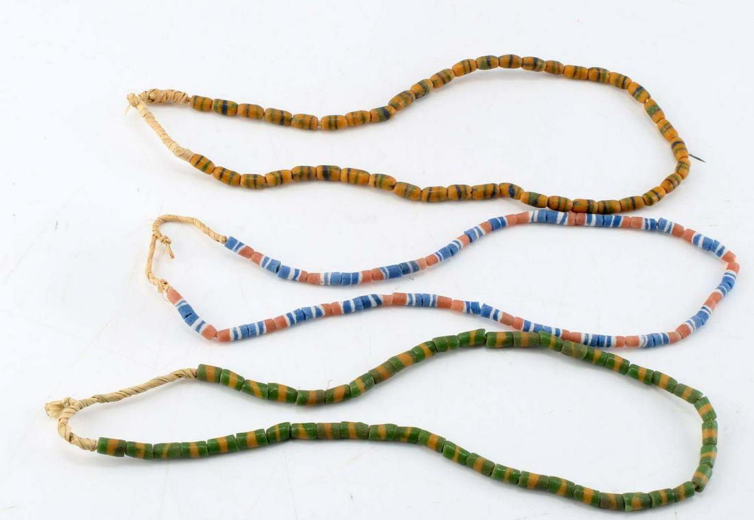 LOT 3 NATIVE AMERICAN TRADE BEAD NECKLACES: Lot of 3 Native American trade bead necklace strings. 29 inches long, strung on natural fiber twine. Good condition. Unauthenticated; sold as is. Weight: Michael