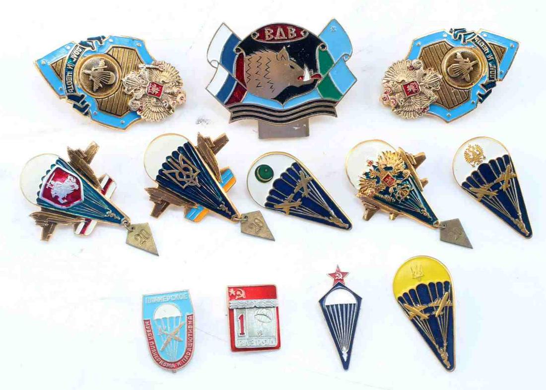 SOVIET ERA MILITARY PARATROOPER BADGE LOT OF 12: Lot of 12 Soviet era military paratrooper badges. Badges from former USSR countries including: Russia, Ukraine, and Belarus. Badges are metal alloy construction with enamel detailing. Clasps and closu