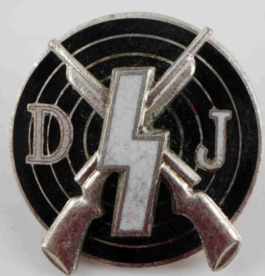 WWII GERMAN THIRD REICH DJ MARKSMAN SHOOTING BADGE: German WWII Deutsches Youth DJ Marksman Shooting Badge. Measures 13/16” in diameter. The reverse side is maker marked ‘RZM M1/123’. Has a thin horizontal safety pin back. Two piece nickel constr