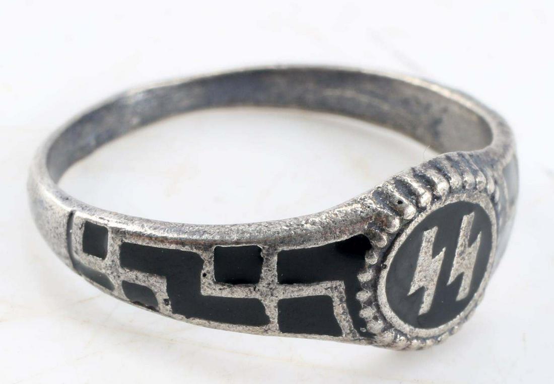 WWII THIRD REICH GERMAN WAFFEN SS SILVER RING: SS runes to front center, swastika design to sides, size 12, marked 800. SS and other markings to interior band. Unauthenticated, sold as is. This lot has a reserve.
