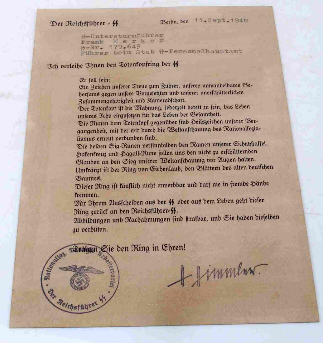 GERMAN SS HONOR RING CERTIFICATE WITH HIMMLER SIGNATURE: WWII German 3rd Reich award citation with Heinrich Himmler signature. Award citation for SS Honor Ring dated 1940. Measures 7.75 inches by 5.50 inches on paper stock. Good condition. Unauthenticated; 