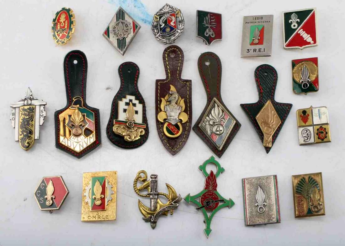 FRENCH FOREIGN LEGION MEDAL BADGE LOT OF 20: Lot of 20 French Foreign Legion medals and badges. measure 1 inch across on average. Most have vertical and broad style pinbacks. Overall, very good condition. Unauthenticated, sold as is.