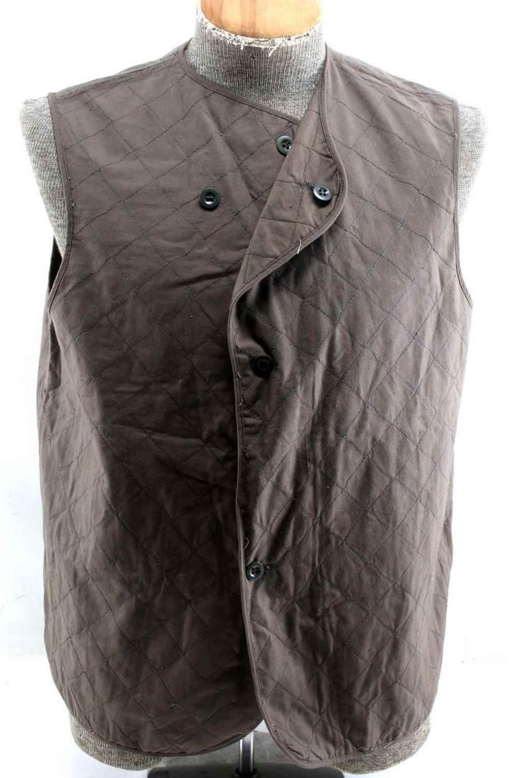 VINTAGE 1970S MILITARY BEGETEX BROWN COTTON VEST: Vintage 1970’s Begetex Military Cotton Vest. The nomenclature tag reads ‘Begetex BB 48’. A medium size. Has a three button front. Multi piece machine sewn grey quilted cotton construction. Very 