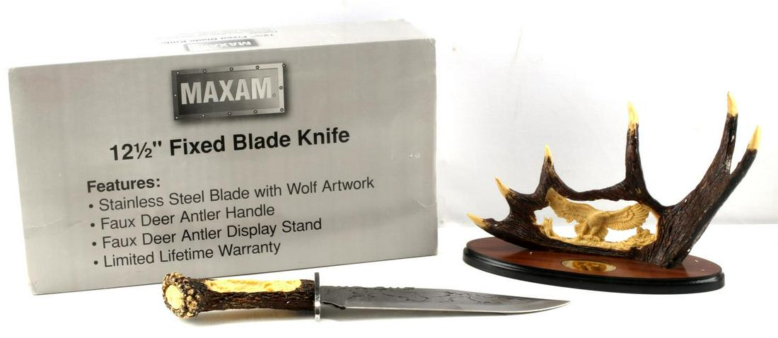 MAXAM EAGLE DECORATIVE FIXED BLADE KNIFE AND STAND: Maxam brand decorative fixed blade knife with faux deer handle and display. Stand measures 8 inches tall by 4.50 inches wide, knife features 9.25 inch blade and is 15 inches overall.